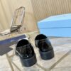 Prada Black Patent Metal Ring Pearl Block-Heel Loafer