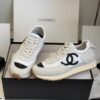 sy_no_DDE6F70509C357A7DC9D48E486735DAF_0 Chanel White and Grey Nylon and Suede Low-Top Sneaker with Black Toe Cap and CC Logo