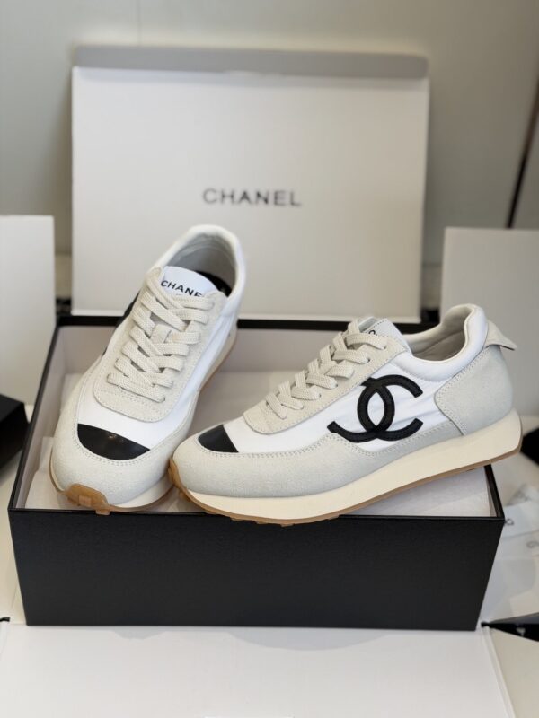 sy_no_DDE6F70509C357A7DC9D48E486735DAF_0 Chanel White and Grey Nylon and Suede Low-Top Sneaker with Black Toe Cap and CC Logo