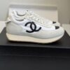 sy_no_DDE6F70509C357A7DC9D48E486735DAF_2 Chanel White and Grey Nylon and Suede Low-Top Sneaker with Black Toe Cap and CC Logo