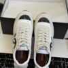 sy_no_DDE6F70509C357A7DC9D48E486735DAF_3 Chanel White and Grey Nylon and Suede Low-Top Sneaker with Black Toe Cap and CC Logo