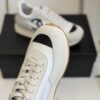 sy_no_DDE6F70509C357A7DC9D48E486735DAF_4 Chanel White and Grey Nylon and Suede Low-Top Sneaker with Black Toe Cap and CC Logo