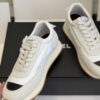 sy_no_DDE6F70509C357A7DC9D48E486735DAF_5 Chanel White and Grey Nylon and Suede Low-Top Sneaker with Black Toe Cap and CC Logo