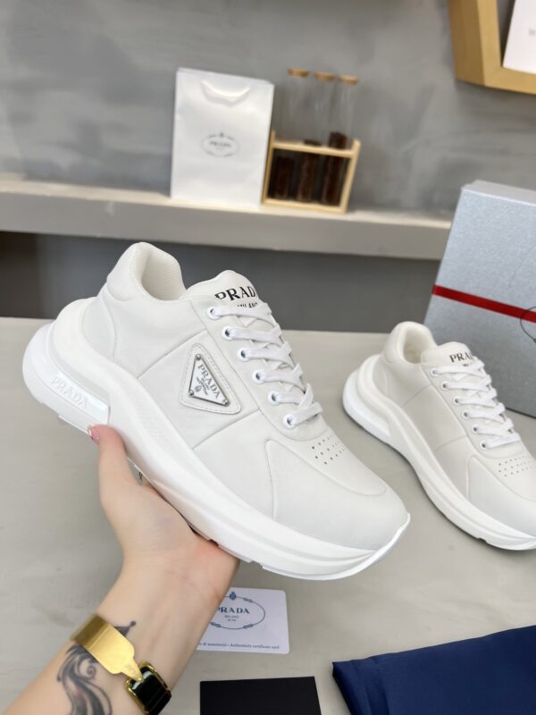 sy_no_E0D5A4917EB9C87270711D75751964BC_0 Prada White Triangle Logo Platform Sneaker