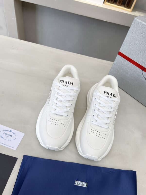 sy_no_E0D5A4917EB9C87270711D75751964BC_2 Prada White Triangle Logo Platform Sneaker
