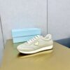 sy_no_E249A52934DC712A867AFA5CEC3A2A41_2 Prada Light Grey Pebbled Leather Retro Runner