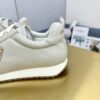 sy_no_E249A52934DC712A867AFA5CEC3A2A41_8 Prada Light Grey Pebbled Leather Retro Runner