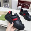 sy_no_E8AE8785DE69A5CB5CDE27786E519D94_0 Gucci Black Leather Chunky Sneaker with Red/Blue Web Stripe & Red Heel Detail