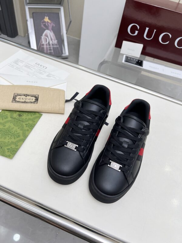 sy_no_E8AE8785DE69A5CB5CDE27786E519D94_3 Gucci Black Leather Chunky Sneaker with Red/Blue Web Stripe & Red Heel Detail