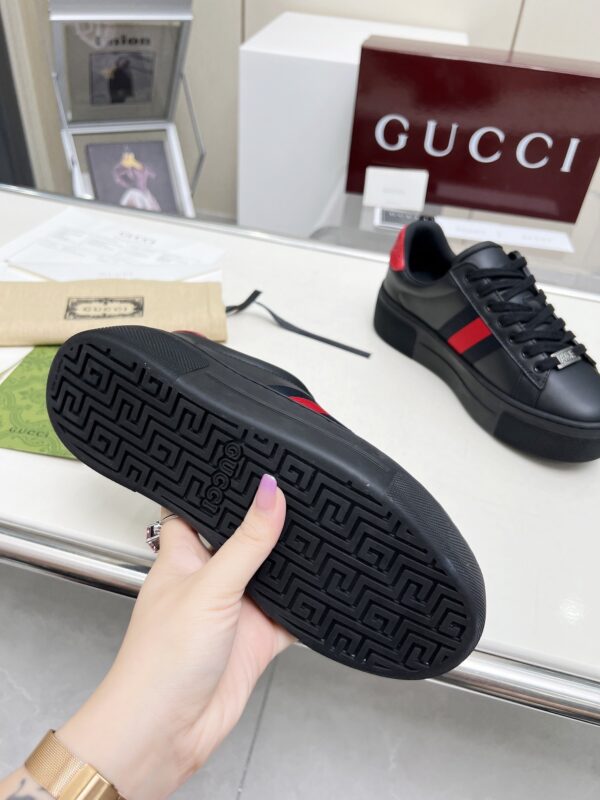 sy_no_E8AE8785DE69A5CB5CDE27786E519D94_5 Gucci Black Leather Chunky Sneaker with Red/Blue Web Stripe & Red Heel Detail