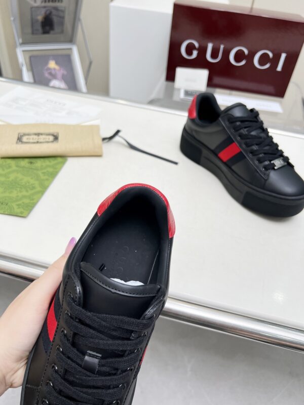 sy_no_E8AE8785DE69A5CB5CDE27786E519D94_7 Gucci Black Leather Chunky Sneaker with Red/Blue Web Stripe & Red Heel Detail