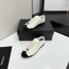 sy_no_EBE9D714E87BFE3714AEF0457AC9E1B2_1 Chanel Off-White and Black Patent Cap-Toe Low-Top Sneaker with CC Lace Lock