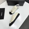 sy_no_EBE9D714E87BFE3714AEF0457AC9E1B2_4 Chanel Off-White and Black Patent Cap-Toe Low-Top Sneaker with CC Lace Lock