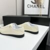 sy_no_EBE9D714E87BFE3714AEF0457AC9E1B2_5 Chanel Off-White and Black Patent Cap-Toe Low-Top Sneaker with CC Lace Lock
