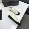 sy_no_EBE9D714E87BFE3714AEF0457AC9E1B2_6 Chanel Off-White and Black Patent Cap-Toe Low-Top Sneaker with CC Lace Lock