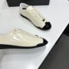 sy_no_EBE9D714E87BFE3714AEF0457AC9E1B2_7 Chanel Off-White and Black Patent Cap-Toe Low-Top Sneaker with CC Lace Lock