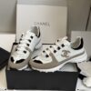 sy_no_EC081D71F35F0D9A4A96AA655C58141D_0 Chanel White and Khaki Mixed Material Low-Top Sneaker with Black Accents and CC Logo