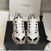 sy_no_EC081D71F35F0D9A4A96AA655C58141D_1 Chanel White and Khaki Mixed Material Low-Top Sneaker with Black Accents and CC Logo