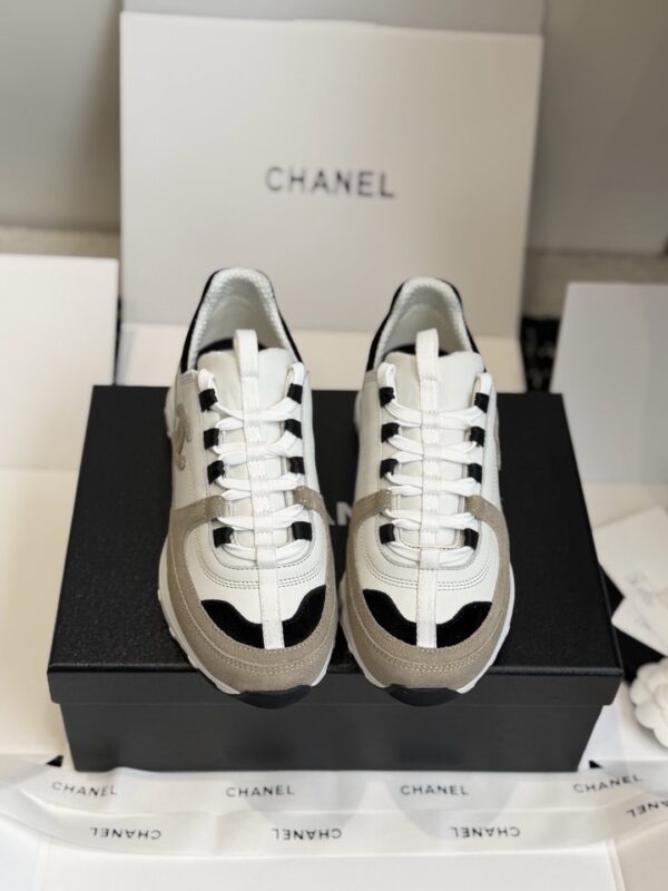sy_no_EC081D71F35F0D9A4A96AA655C58141D_1 Chanel White and Khaki Mixed Material Low-Top Sneaker with Black Accents and CC Logo