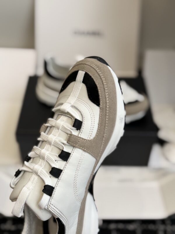 sy_no_EC081D71F35F0D9A4A96AA655C58141D_2 Chanel White and Khaki Mixed Material Low-Top Sneaker with Black Accents and CC Logo