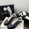Chanel Black Quilted Leather Low-Top Sneaker with White Laces and CC Logo
