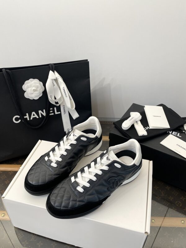 Chanel Black Quilted Leather Low-Top Sneaker with White Laces and CC Logo