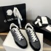 Chanel Black Quilted Leather Low-Top Sneaker with White Laces and CC Logo