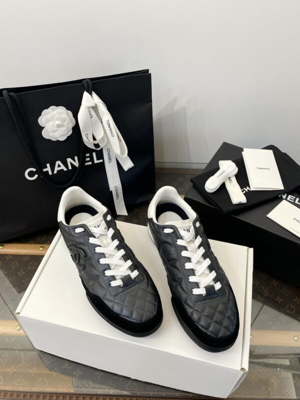 Chanel Black Quilted Leather Low-Top Sneaker with White Laces and CC Logo