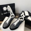 Chanel Black Quilted Leather Low-Top Sneaker with White Laces and CC Logo