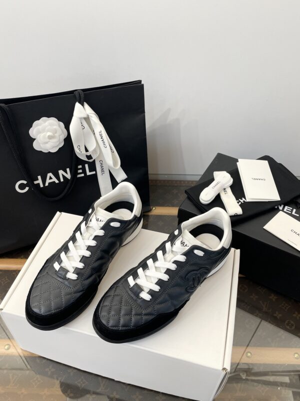 Chanel Black Quilted Leather Low-Top Sneaker with White Laces and CC Logo