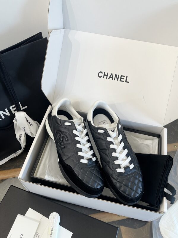 Chanel Black Quilted Leather Low-Top Sneaker with White Laces and CC Logo