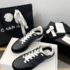 Chanel Black Quilted Leather Low-Top Sneaker with White Laces and CC Logo