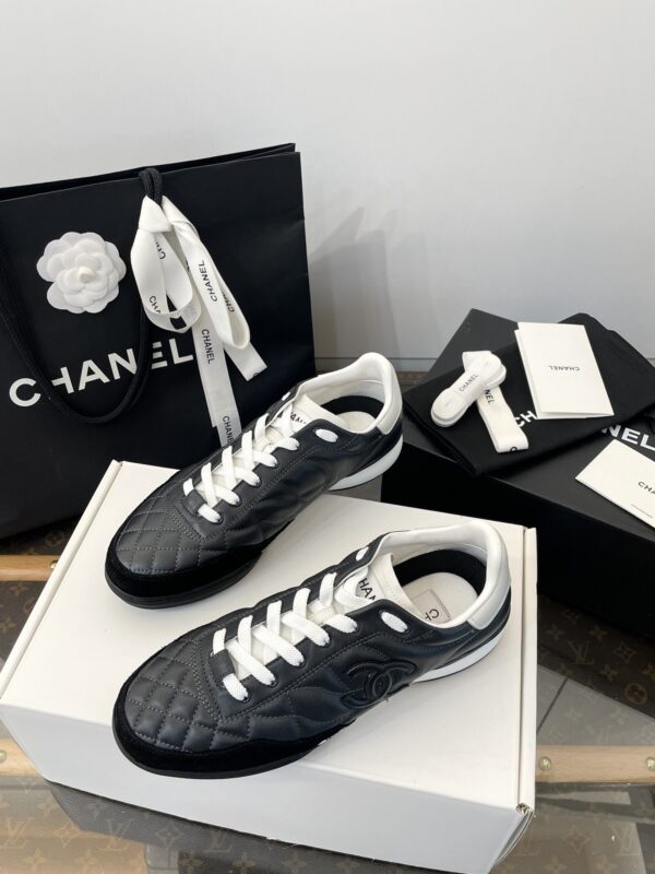 Chanel Black Quilted Leather Low-Top Sneaker with White Laces and CC Logo