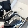 Chanel Black Quilted Leather Low-Top Sneaker with White Laces and CC Logo