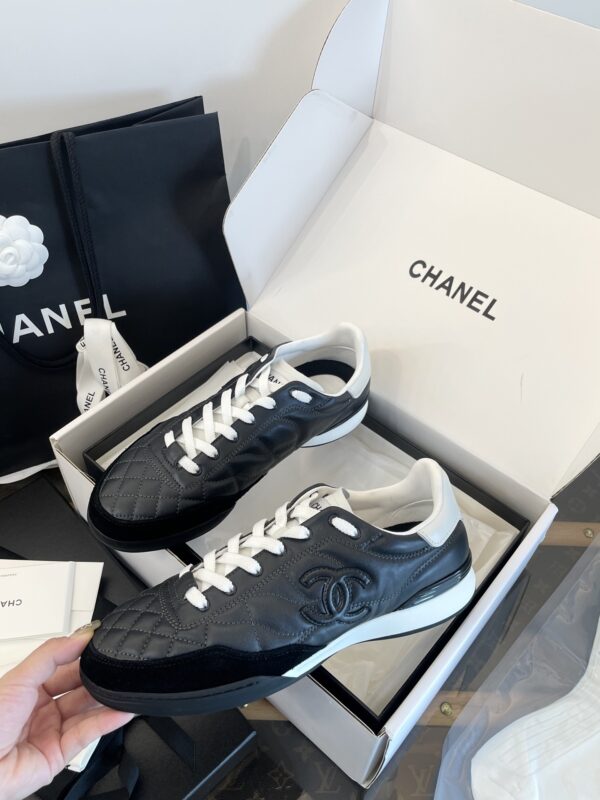 Chanel Black Quilted Leather Low-Top Sneaker with White Laces and CC Logo