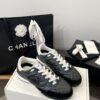 Chanel Black Quilted Leather Low-Top Sneaker with White Laces and CC Logo