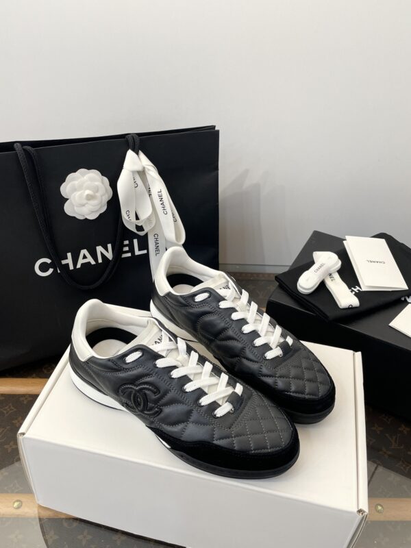 Chanel Black Quilted Leather Low-Top Sneaker with White Laces and CC Logo