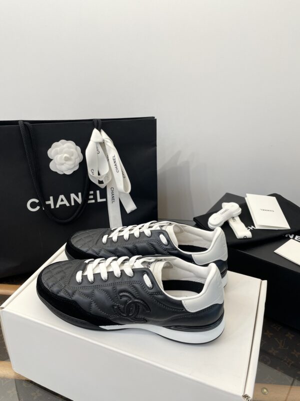Chanel Black Quilted Leather Low-Top Sneaker with White Laces and CC Logo