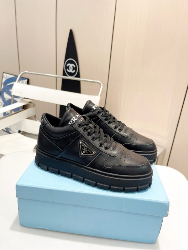 sy_no_F888DBA842C1C7C1EAAE3B5BA78B5DE2_0 Prada All-Black Triangle Logo Chunky Platform Sneaker