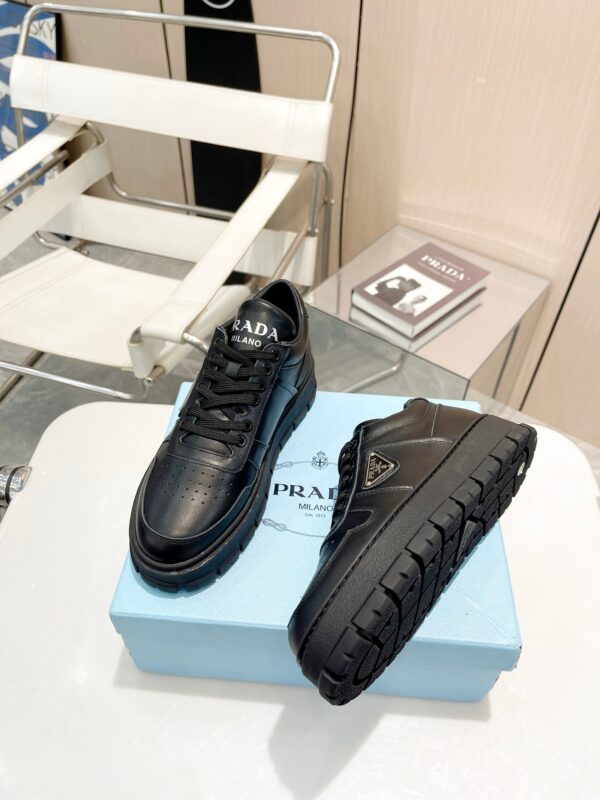 sy_no_F888DBA842C1C7C1EAAE3B5BA78B5DE2_1 Prada All-Black Triangle Logo Chunky Platform Sneaker