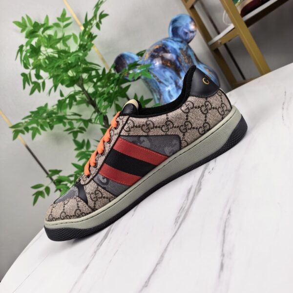 sy_no_FA220419E7A7D903FA11B0750C9E12A0_1 Gucci Screener Sneaker in GG Supreme Canvas with Red/Black Web Stripe & Orange Laces