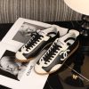 sy_no_77EA8EB622D1FD19F9B11B70AF8ED608_2 CHANEL Black & White Color-Blocked Retro Trainer Sneaker