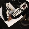 sy_no_D213CC8D5E4908BB5C7AE4998A3E7EBD_4 CHANEL Black & White Two-Tone Retro Trainer Sneaker